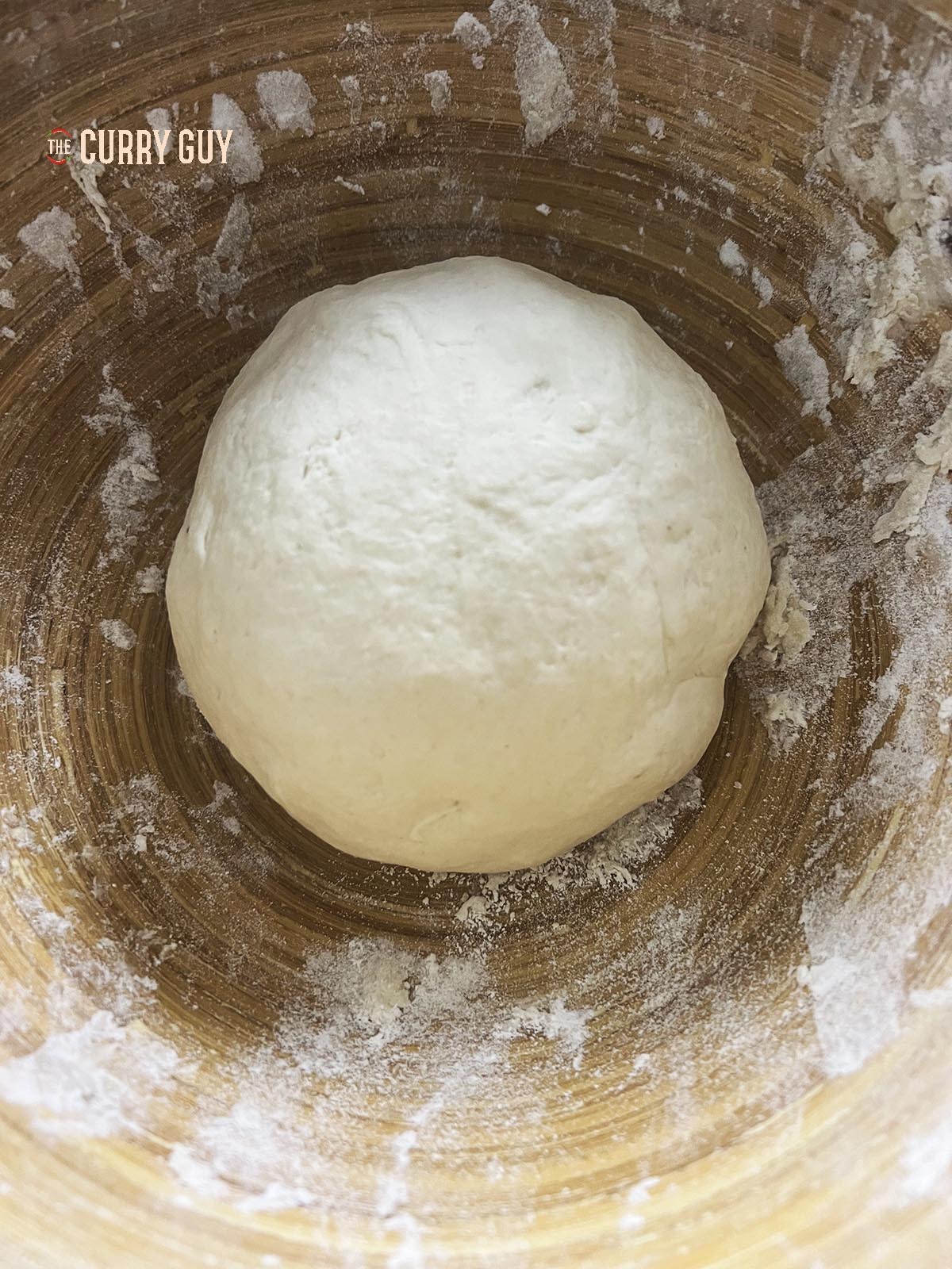 Dough ball resting before rolling out into wrappers.