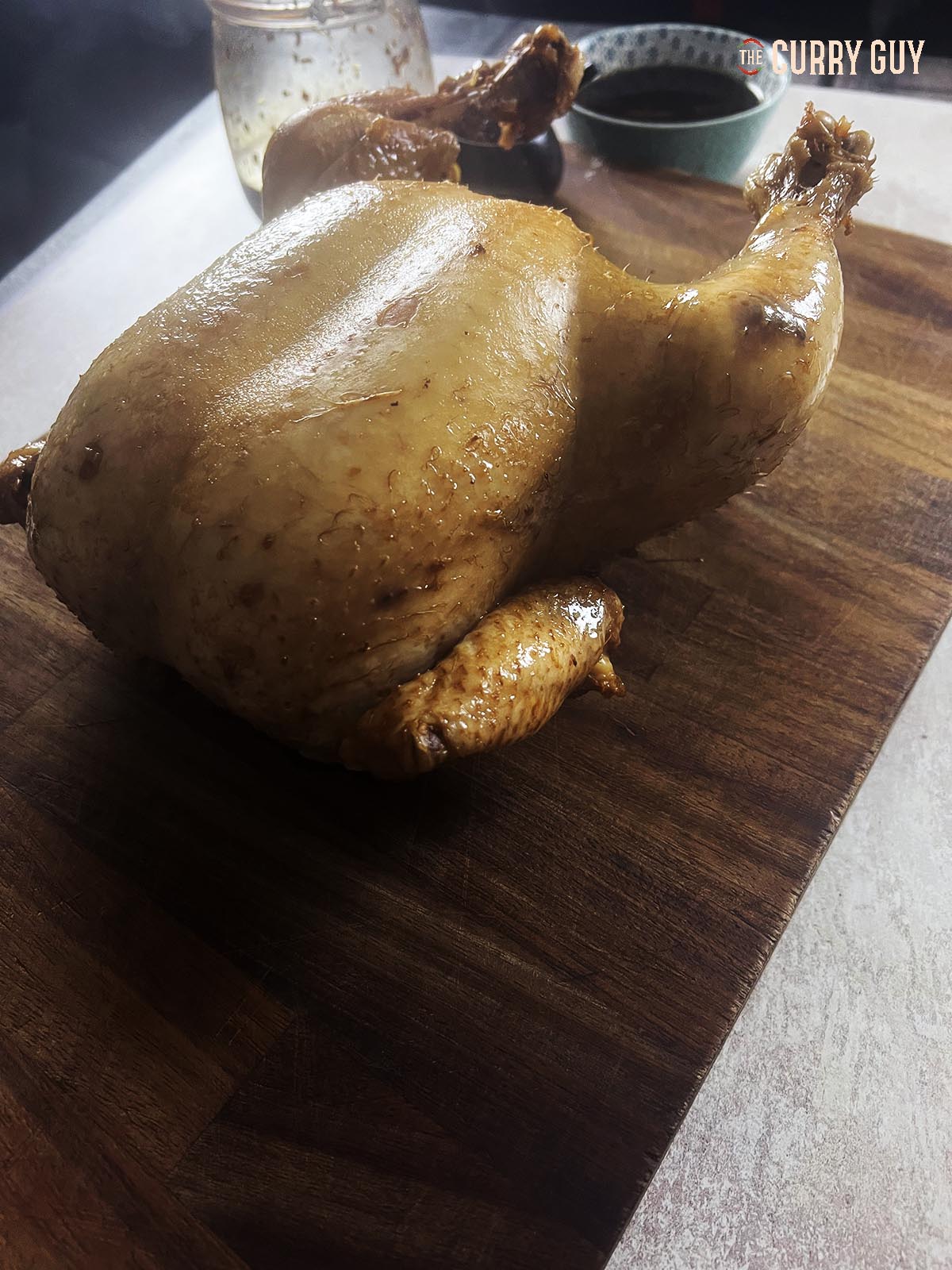 Soy sauce chicken. A whole chicken ready for slicing. 