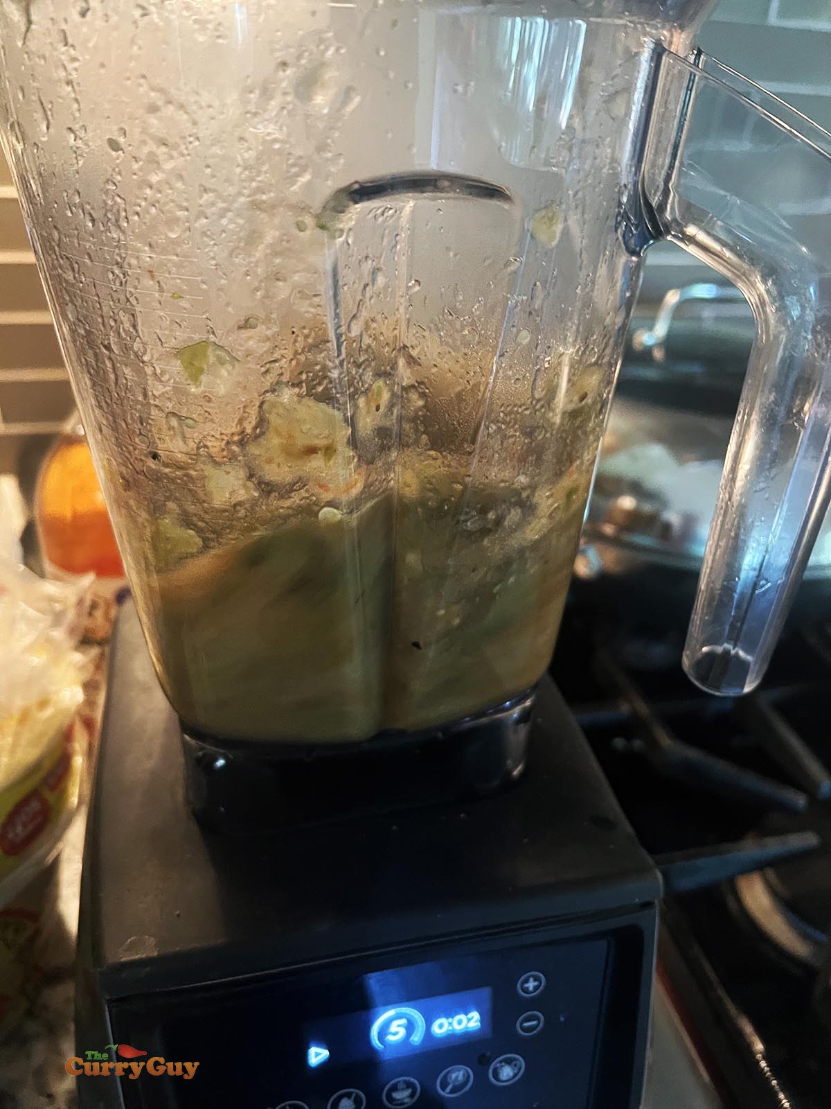 Blending the tomatillo and tomato salsa