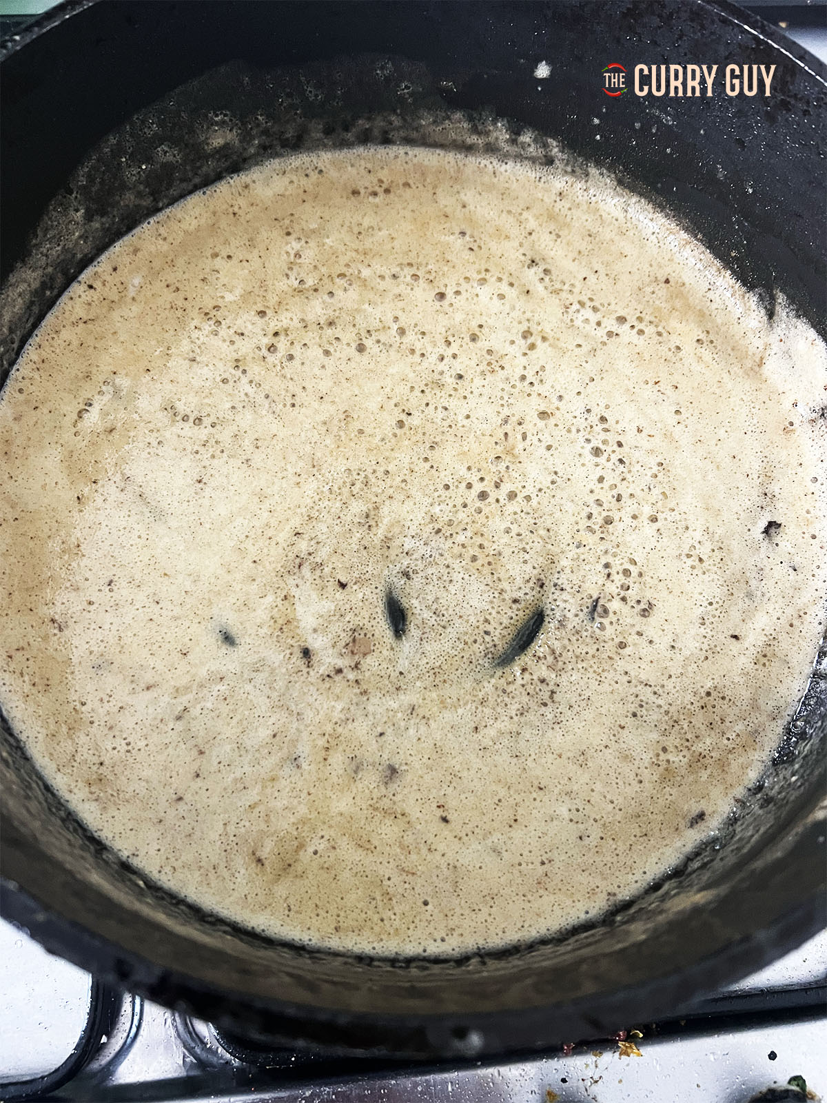 The roux in a golden brown colour from simmering.