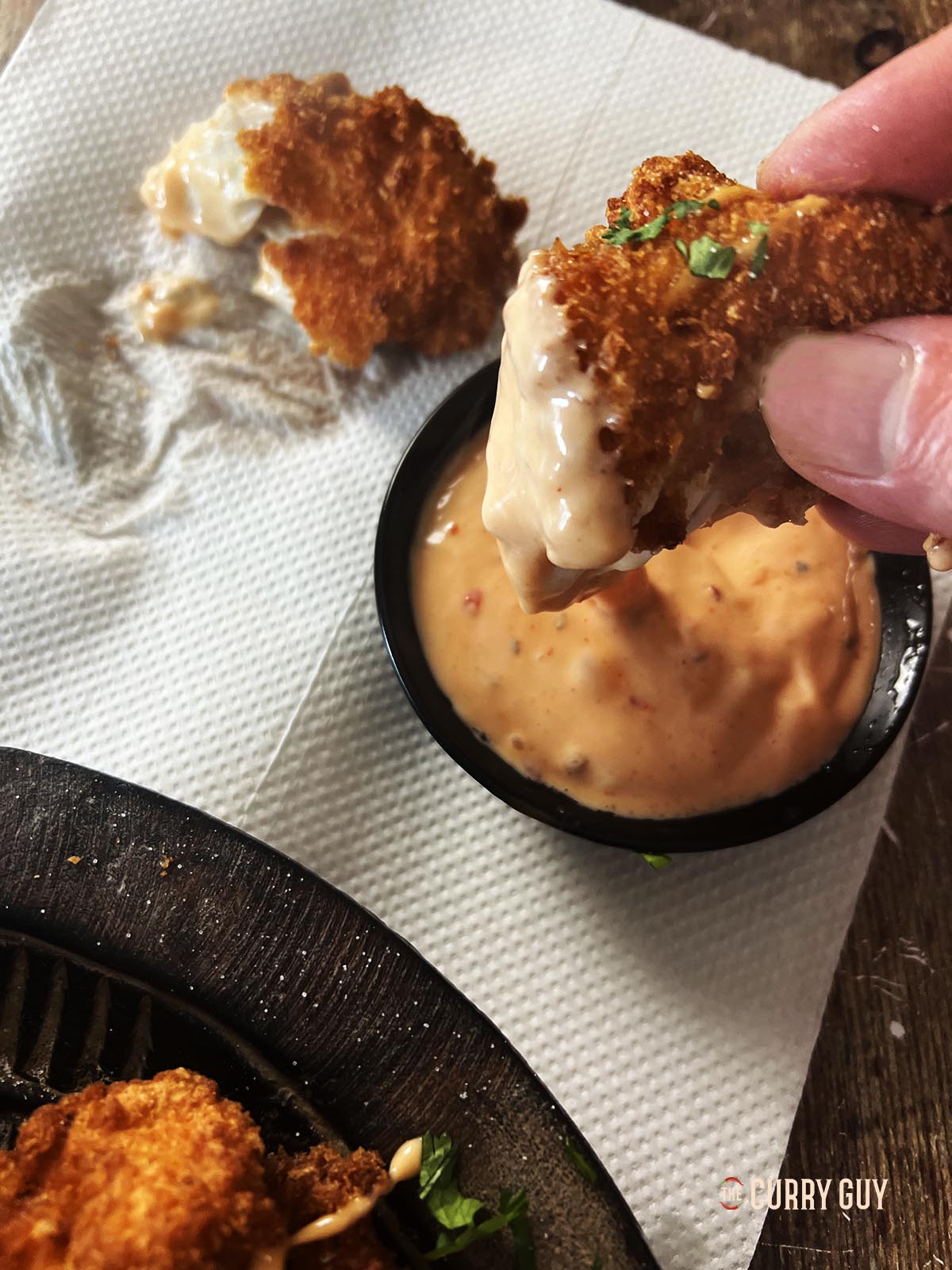 bang bang chicken dipped in the sauce.