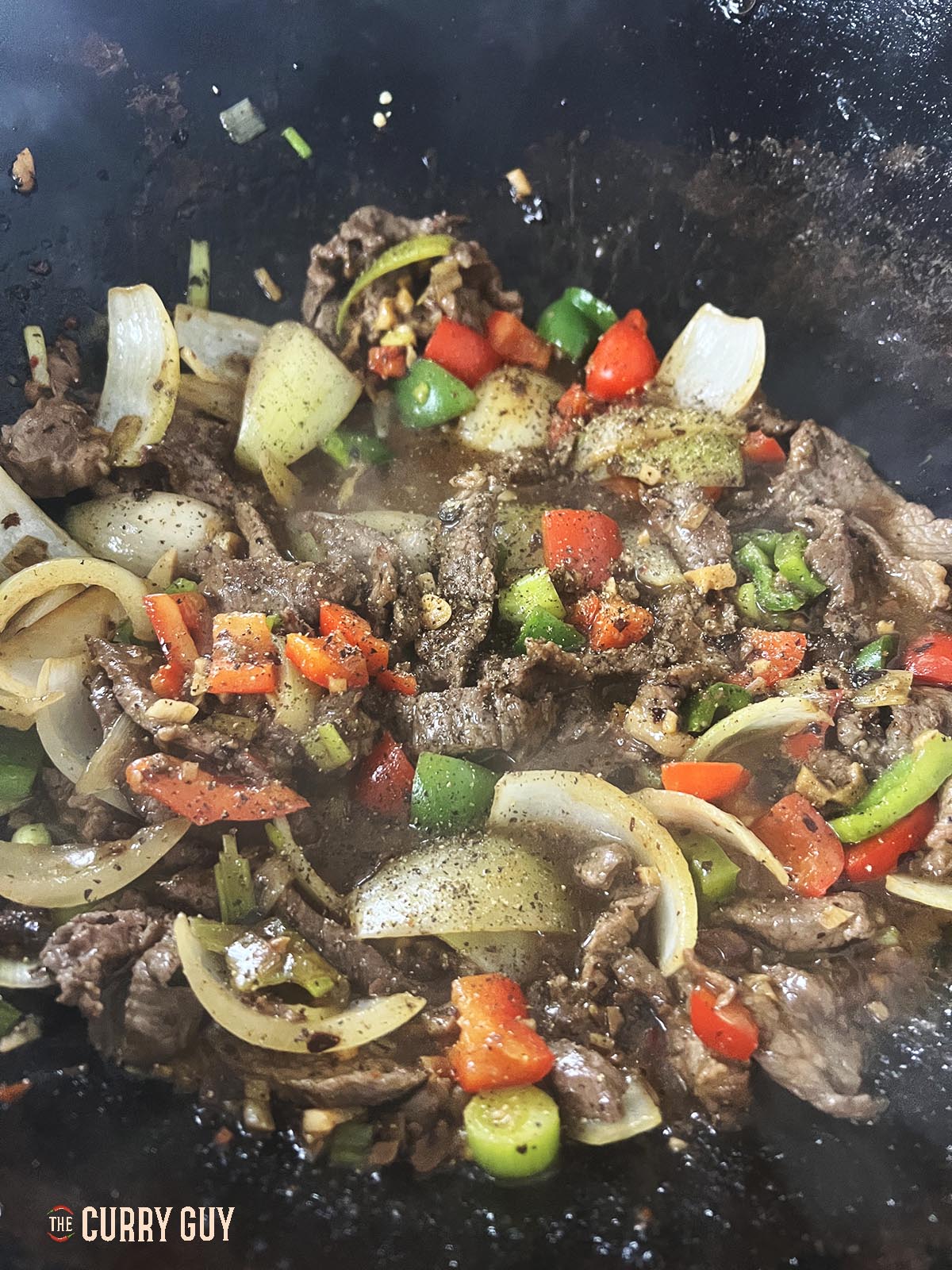 Seasoning with freshly ground black pepper.