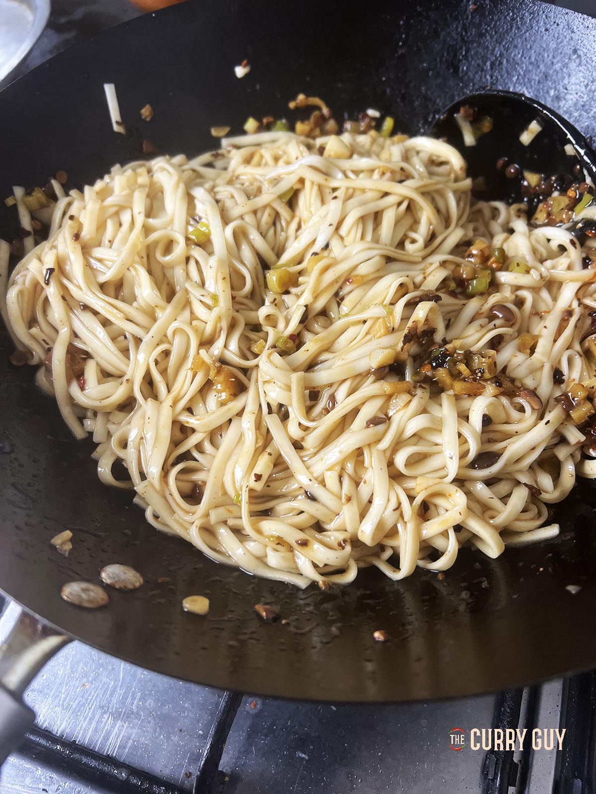 Noodles coated in black bean sauce and sesame oil.