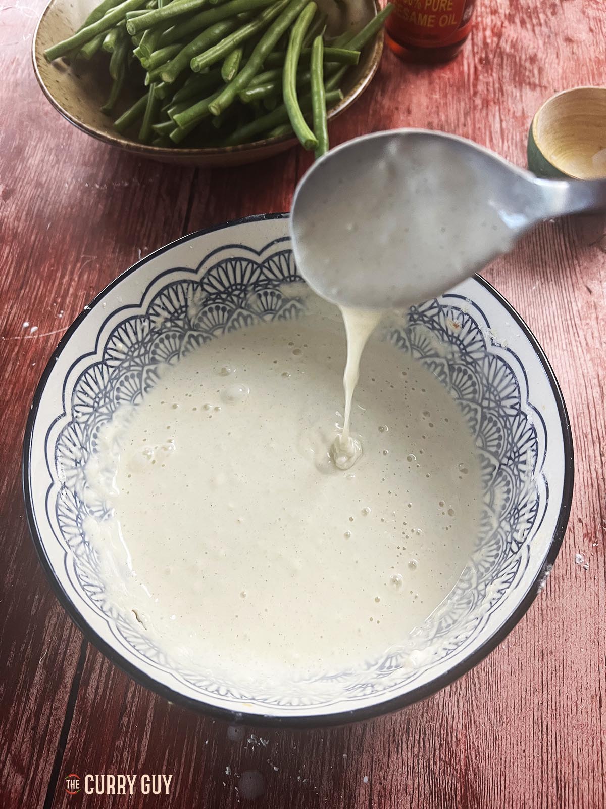 Adding the sparkling water and sesame oil.
