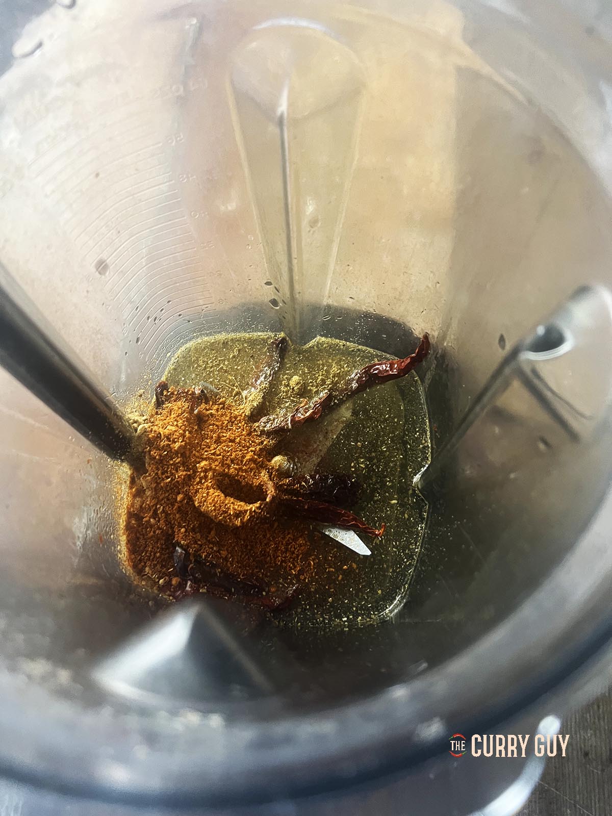 The Kashmiri chillies, tandoori masala and ground ginger in a blender