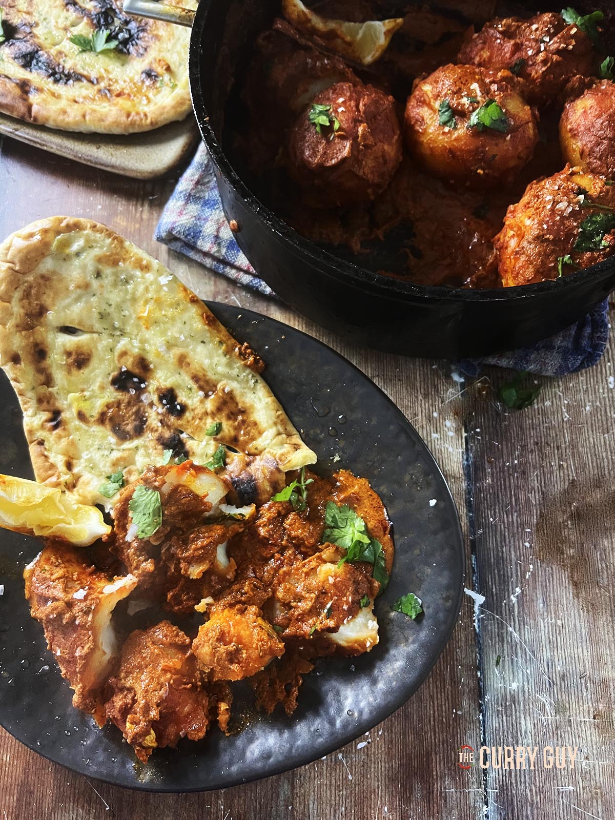 Dum aloo served with naan bread.