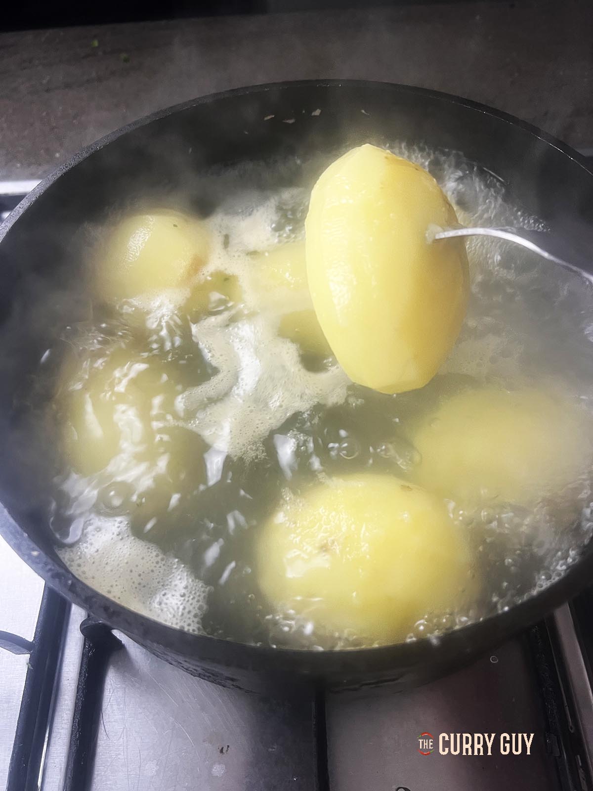 Boiling the potatoes.