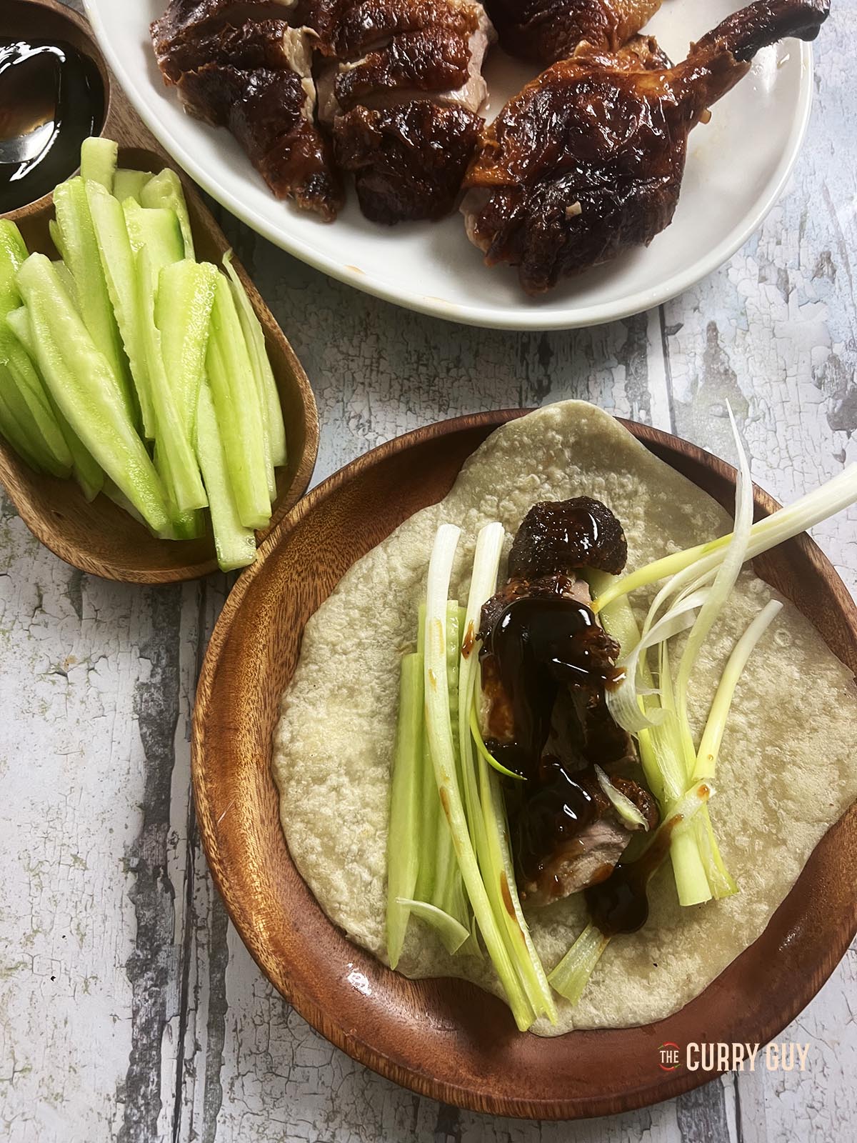 A Peking duck wrap being prepared.