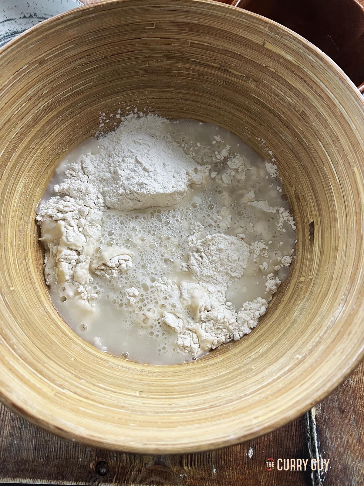 The flour and water in a mixing bowl.