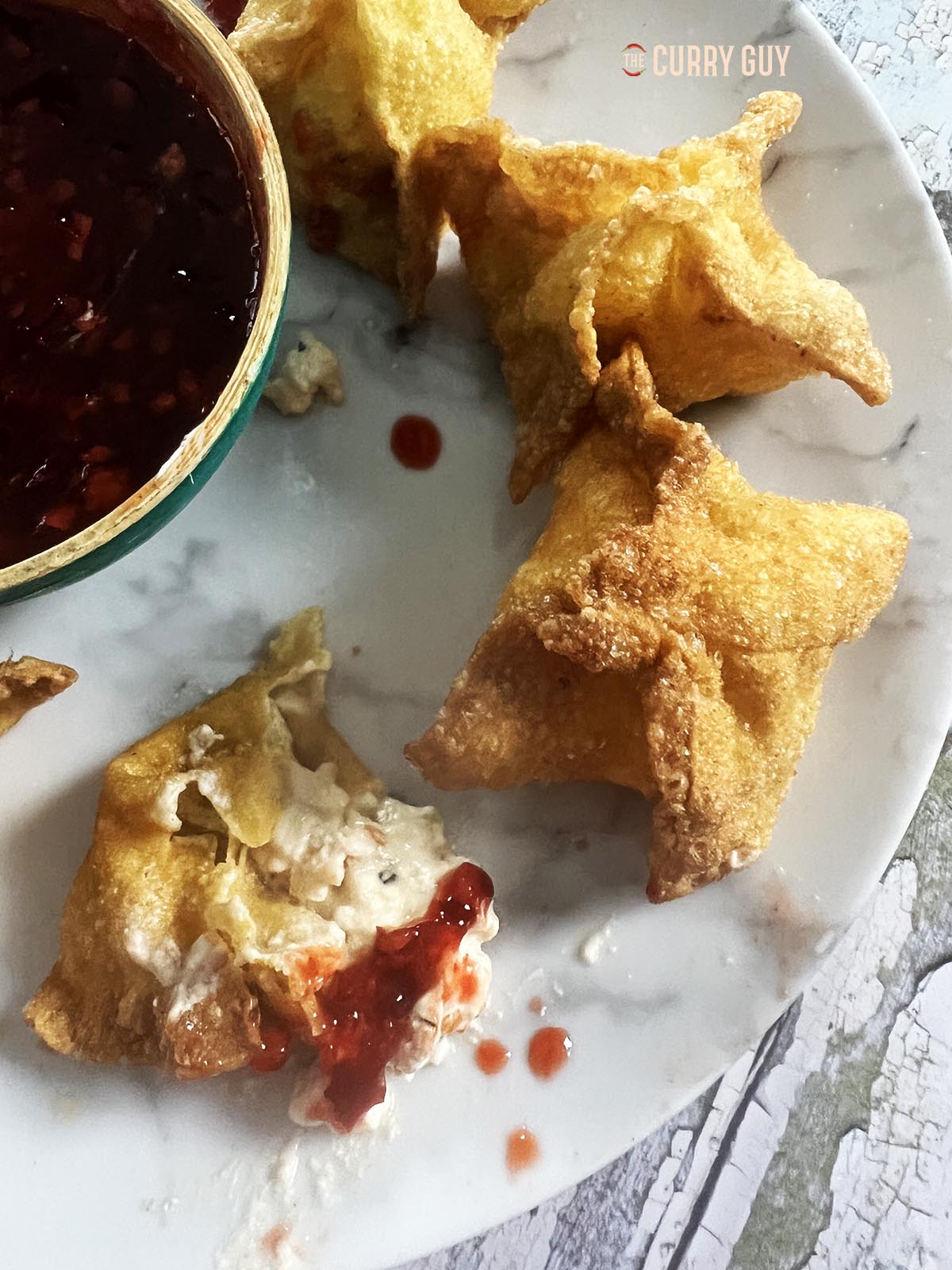 Shrimp rangoon on a serving plate.