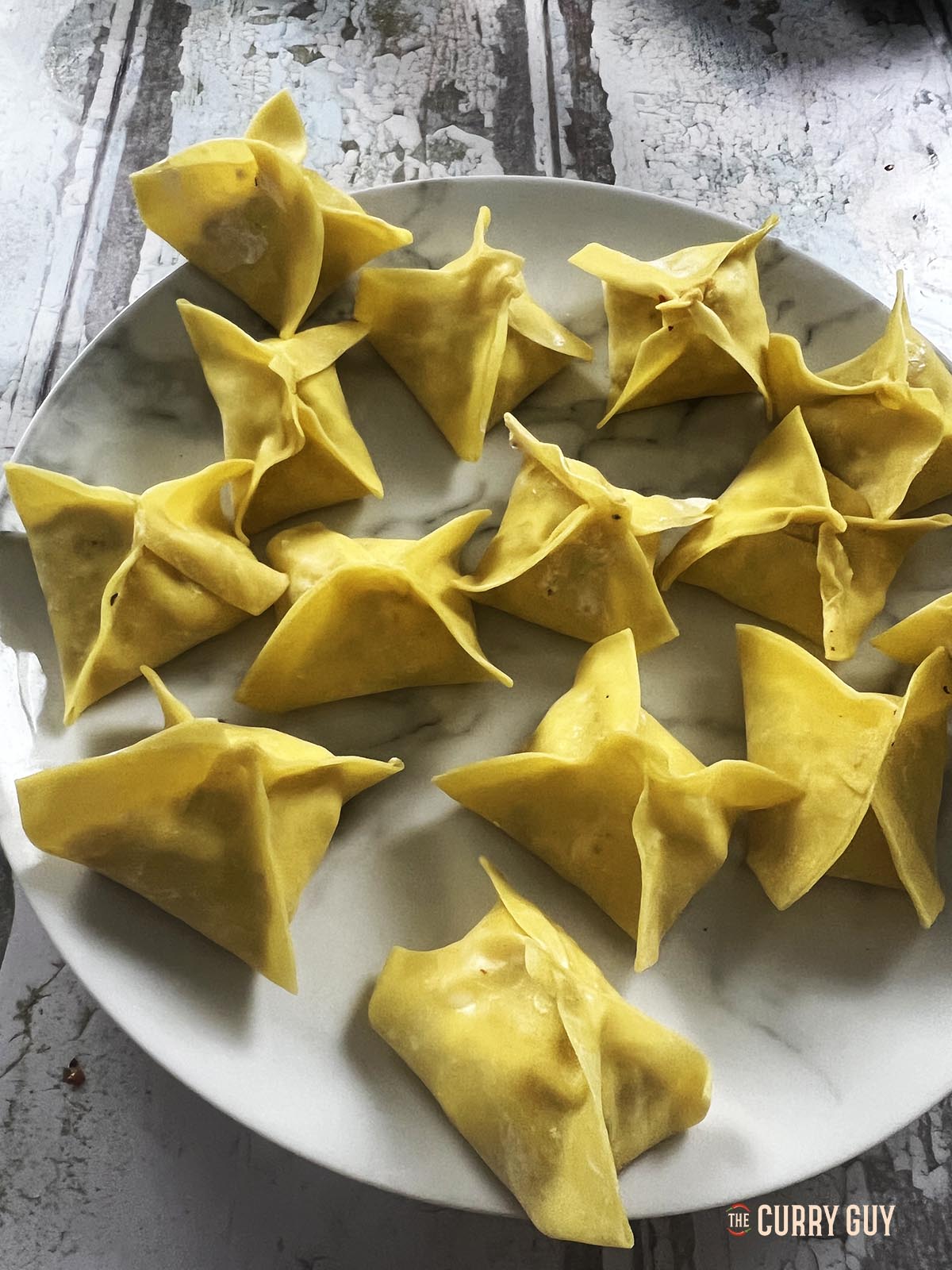 All of the shrimp rangoon parcels ready for frying.