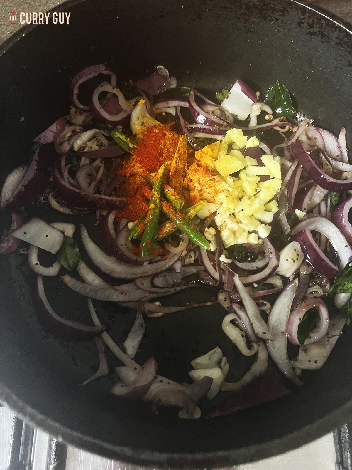 Adding the garlic, ginger, chillies and ground spices.