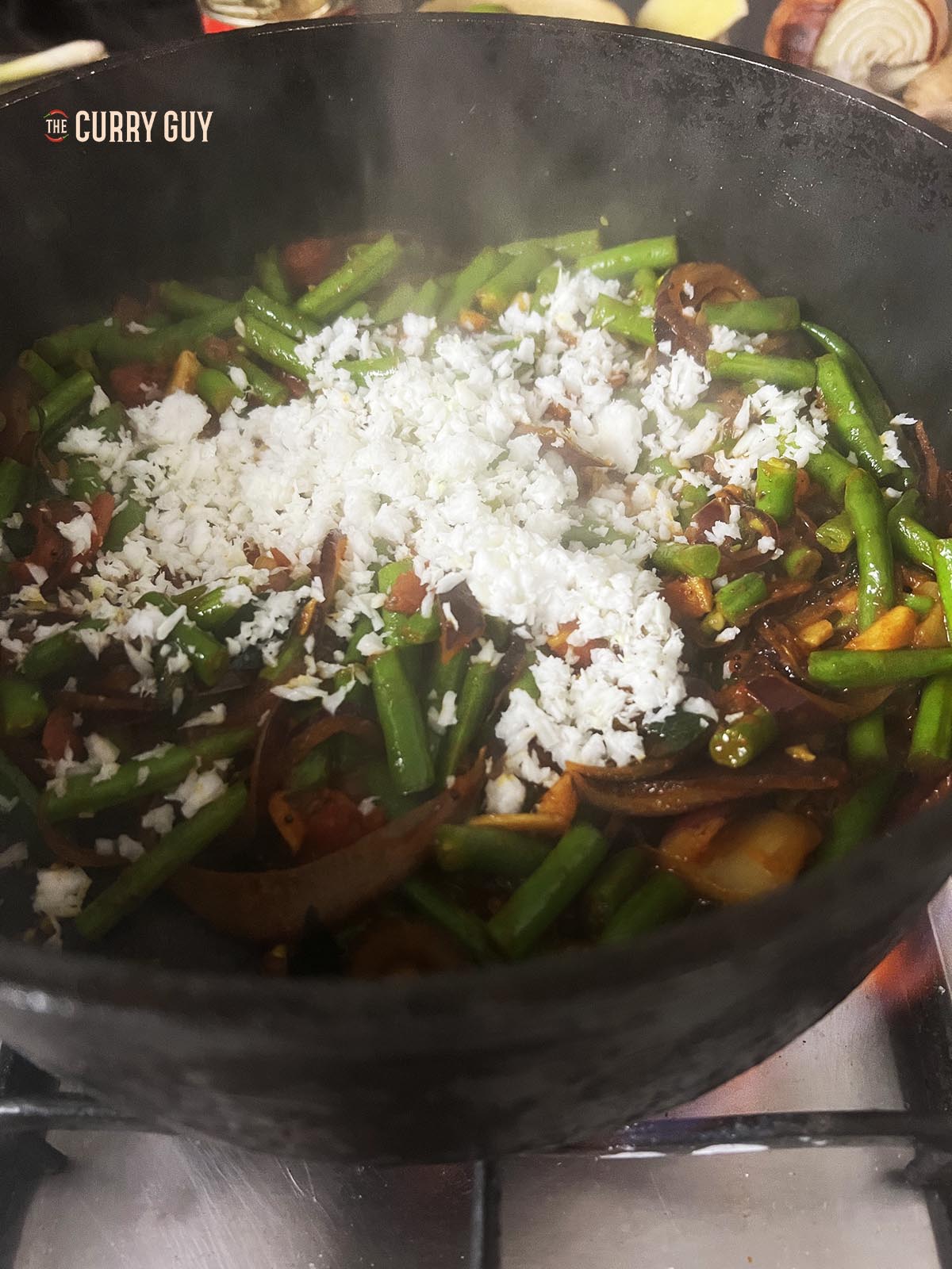 Adding the grated coconut.