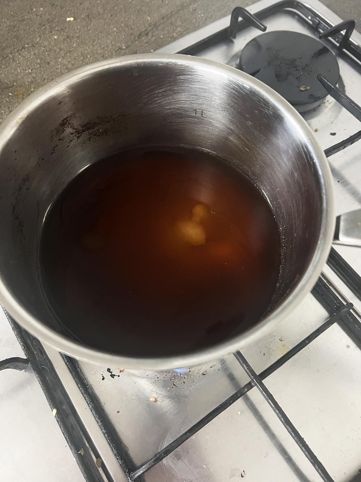 The vinegar, water and sugar in a sauce pan.