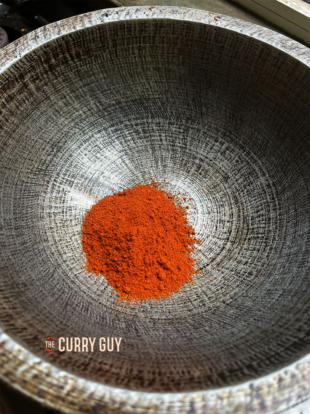 Toasting the red chilli powder.