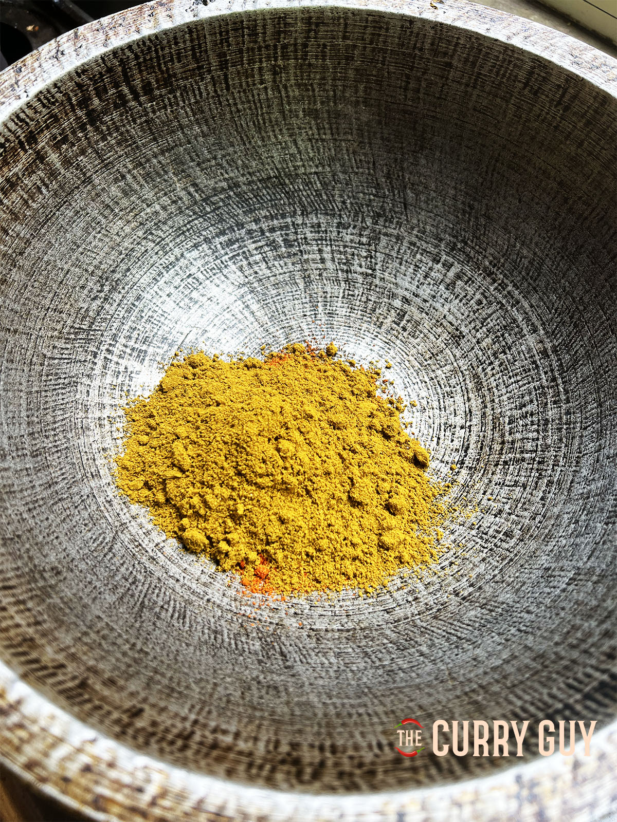 Roasting the chilli powder and curry powder