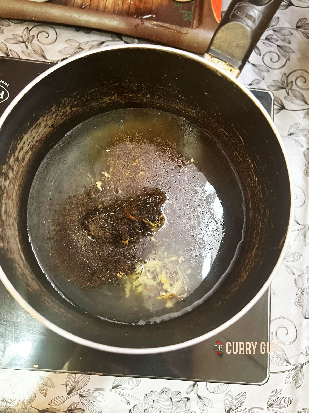 Simmering the spices in the water for the tea.