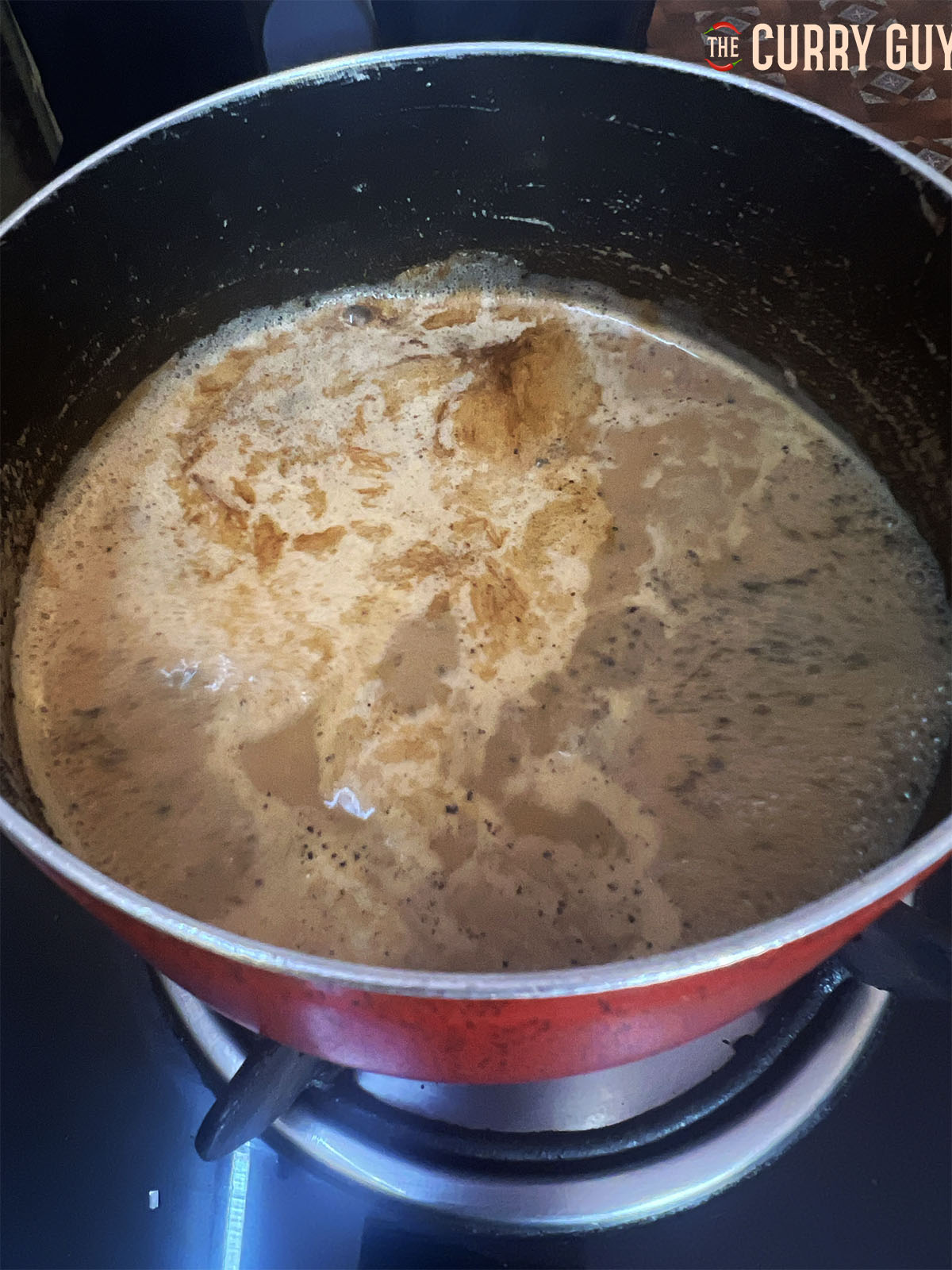 Simmering the tea with the ginger and spices.