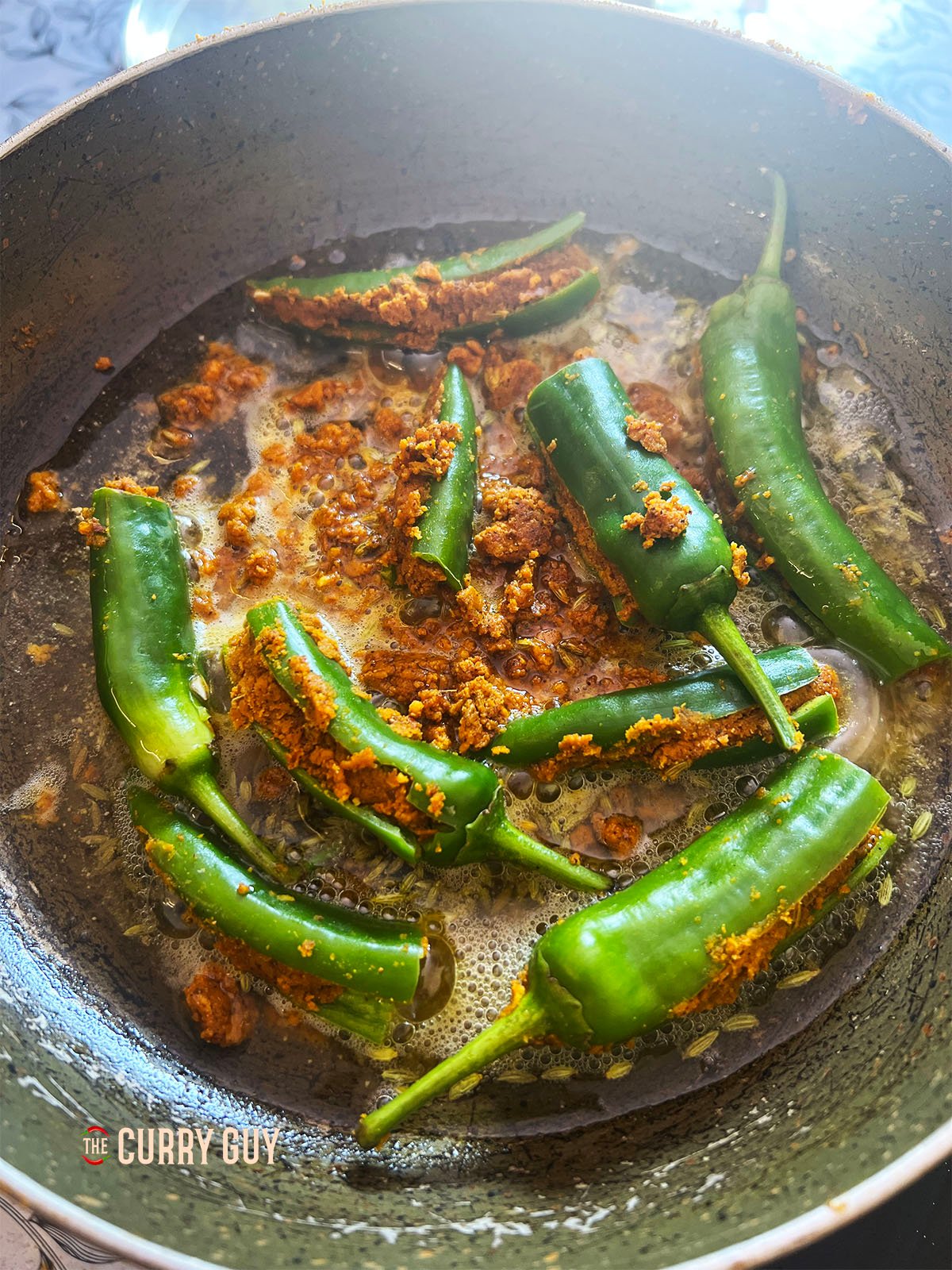 Adding the excess stuffing to the pan.