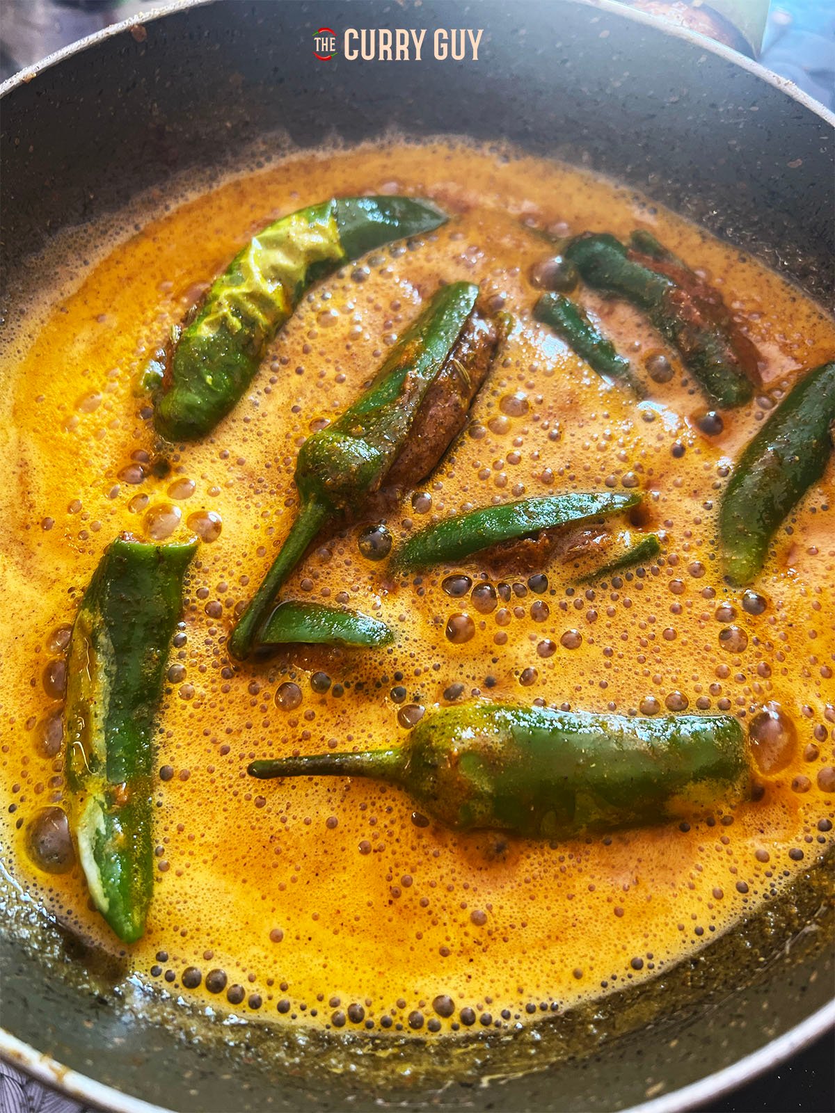 Green stuffed chiillies in a chickpea flour sauce.