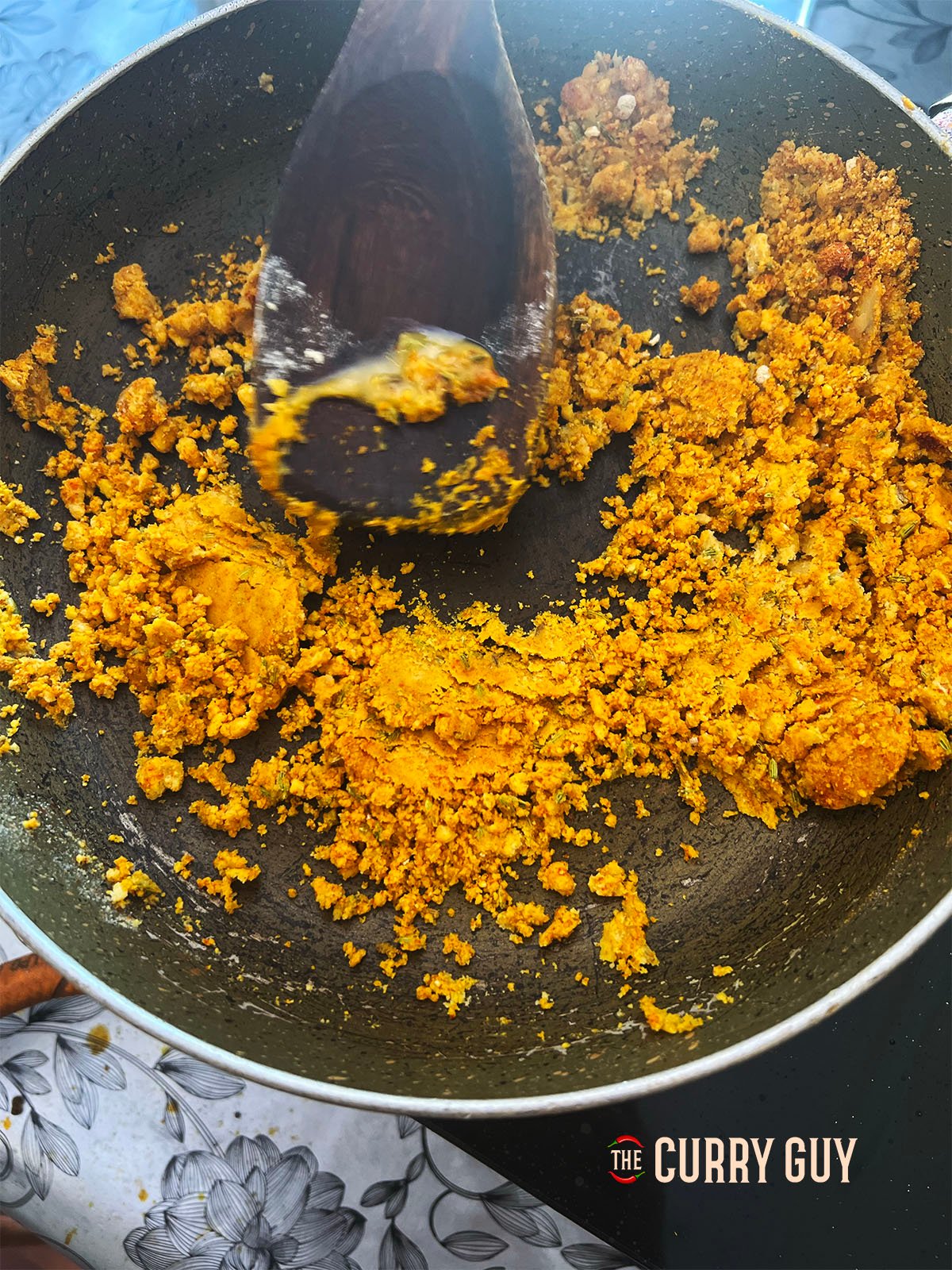 Stirring the ingredients in the pan together.