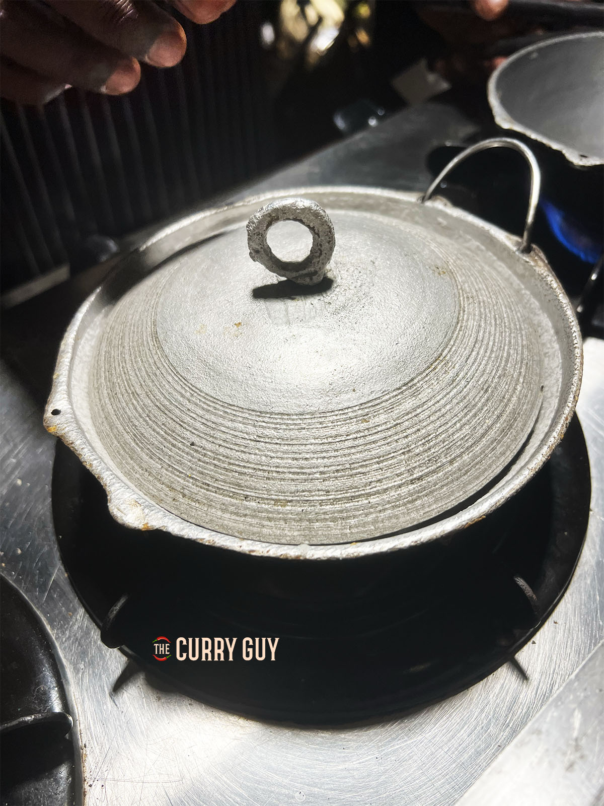 Cooking the hopper in a pan with the lid on.
