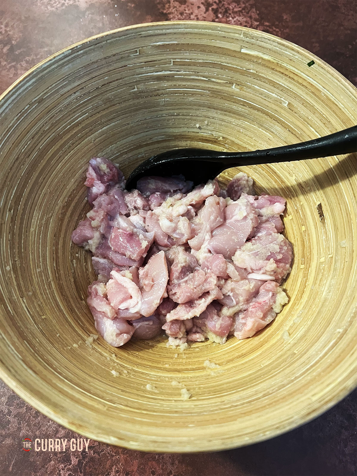 Marinating the chicken in the first marinade.