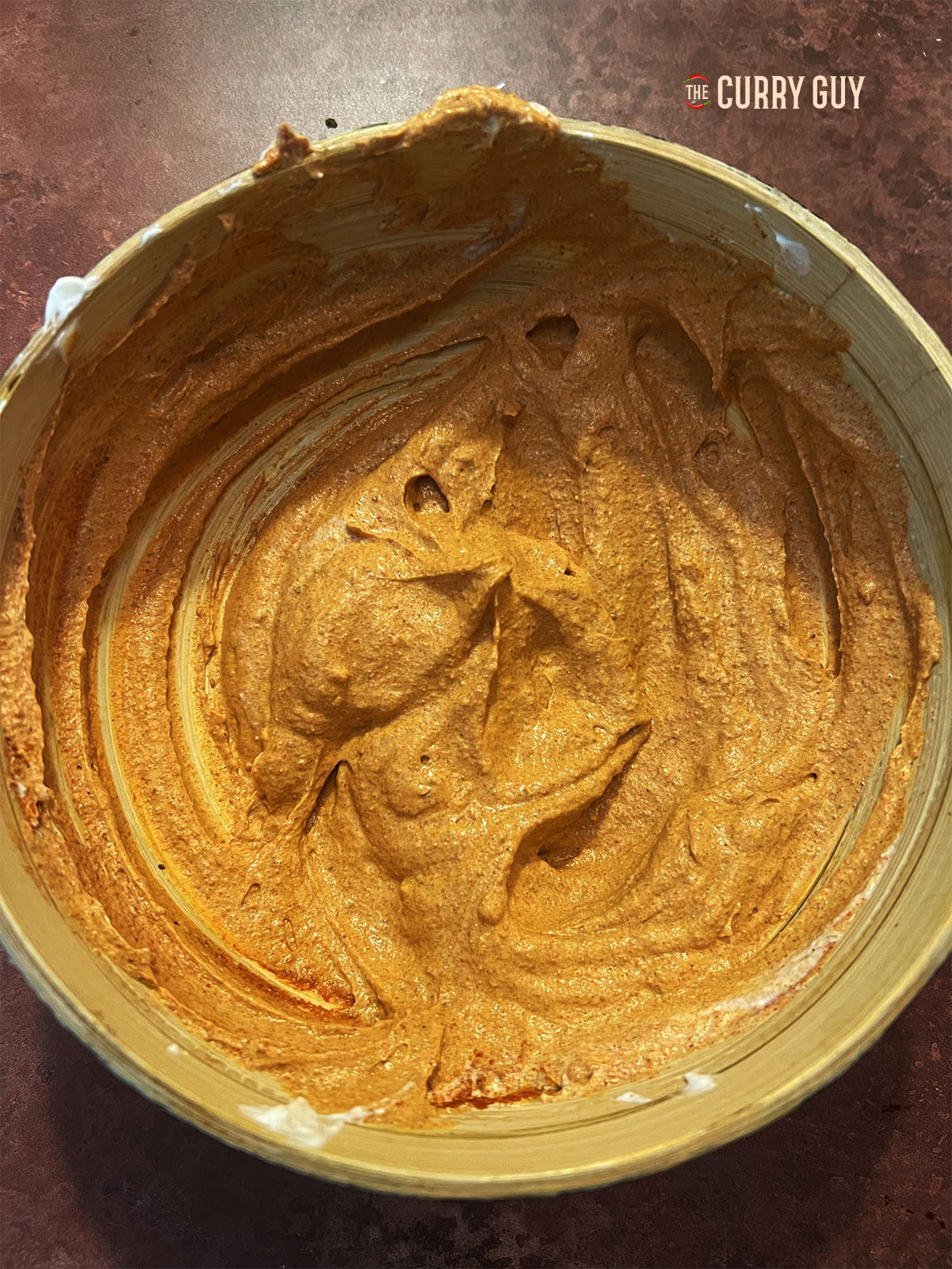 The garlic and ginger and the spices whisked into the yoghurt base.