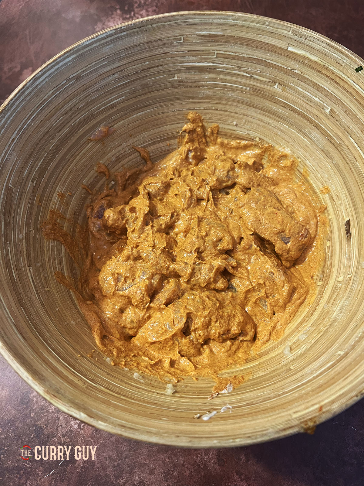 Marinating the chicken tikka.