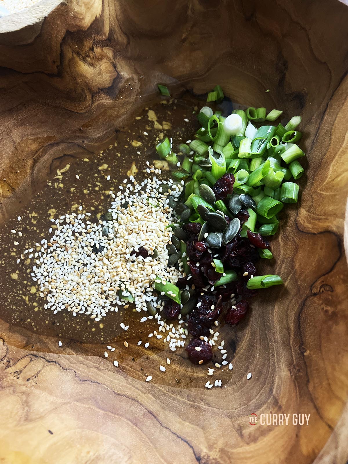 Making the dressing in a salad bowl.