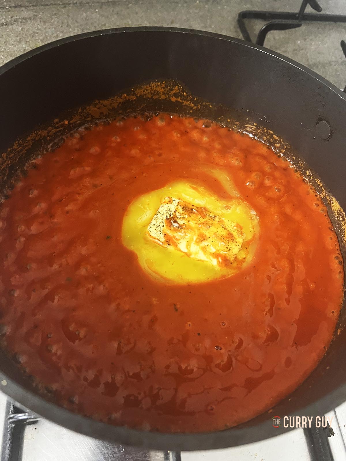 Simmering the buffalo sauce.