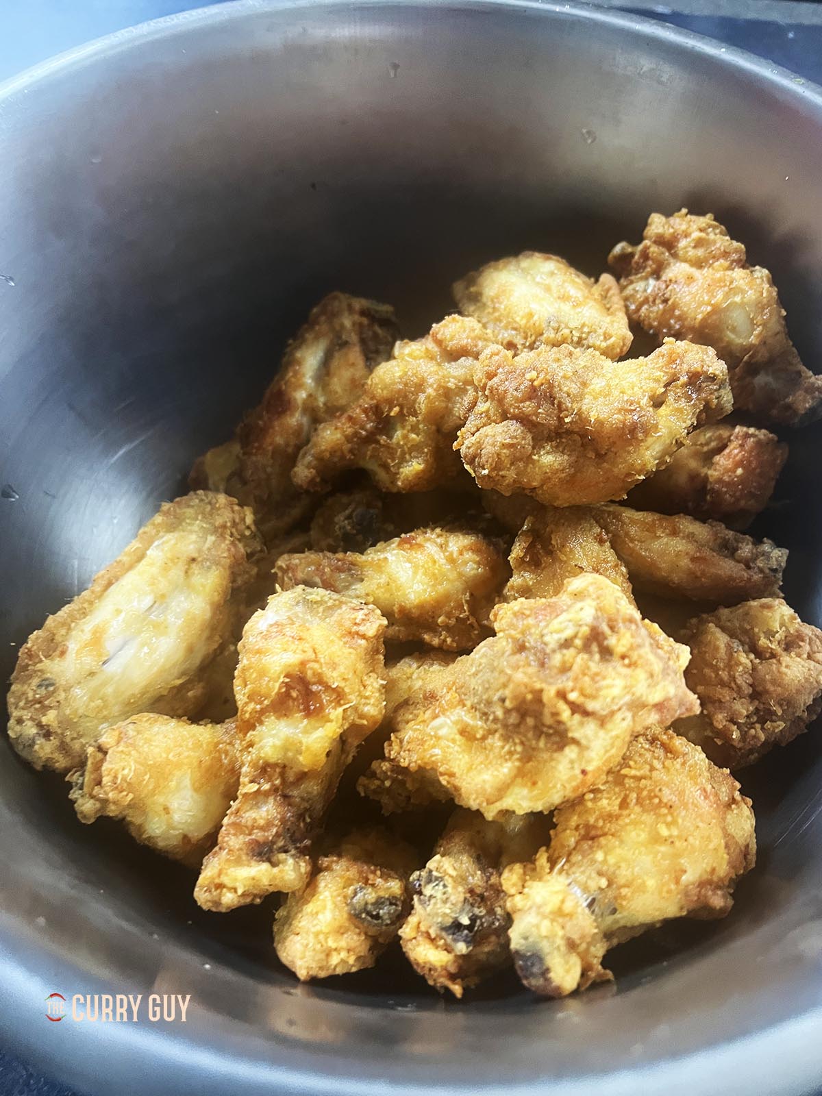 Fried chicken wings ready for the Buffalo sauce.