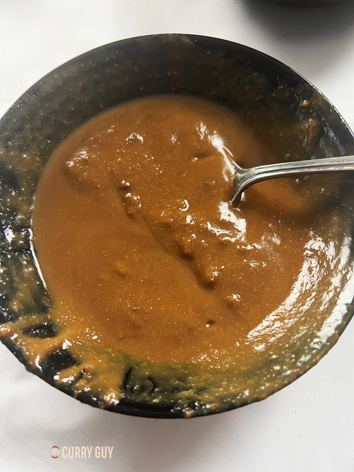 Whisking the miso and water together until smooth.