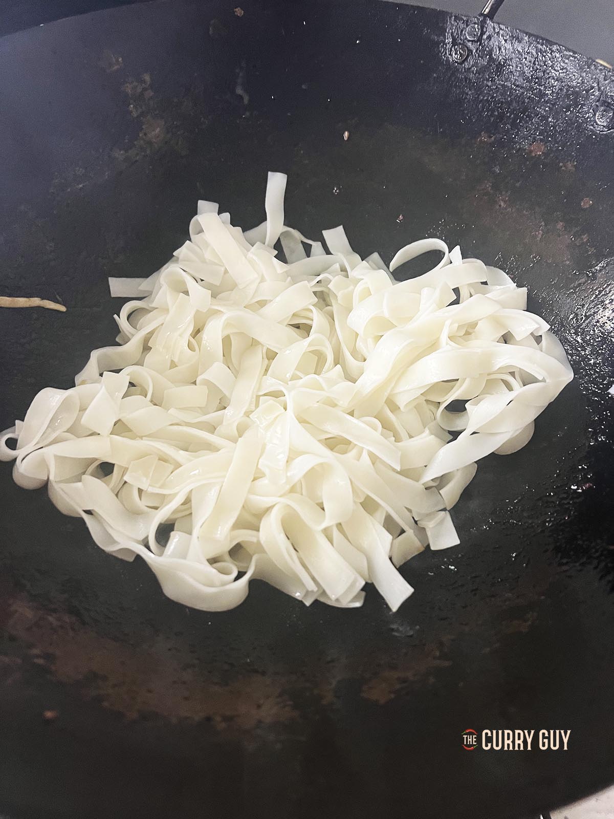 Frying the noodles.