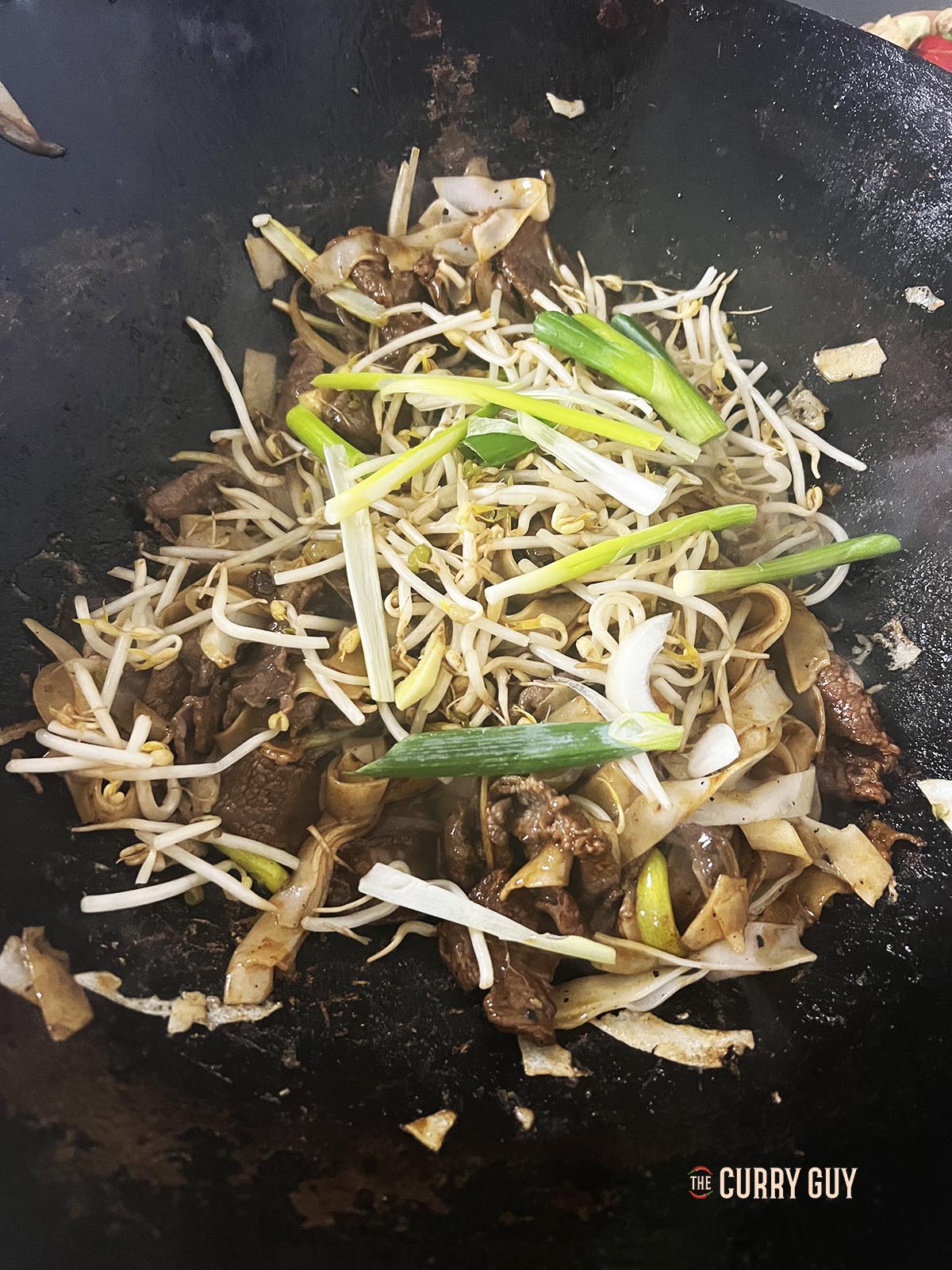 Finishing the dish in the wok;