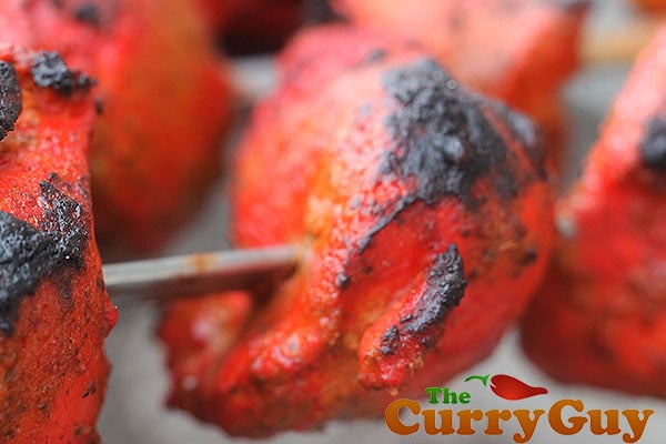 Bright red chicken tikka.