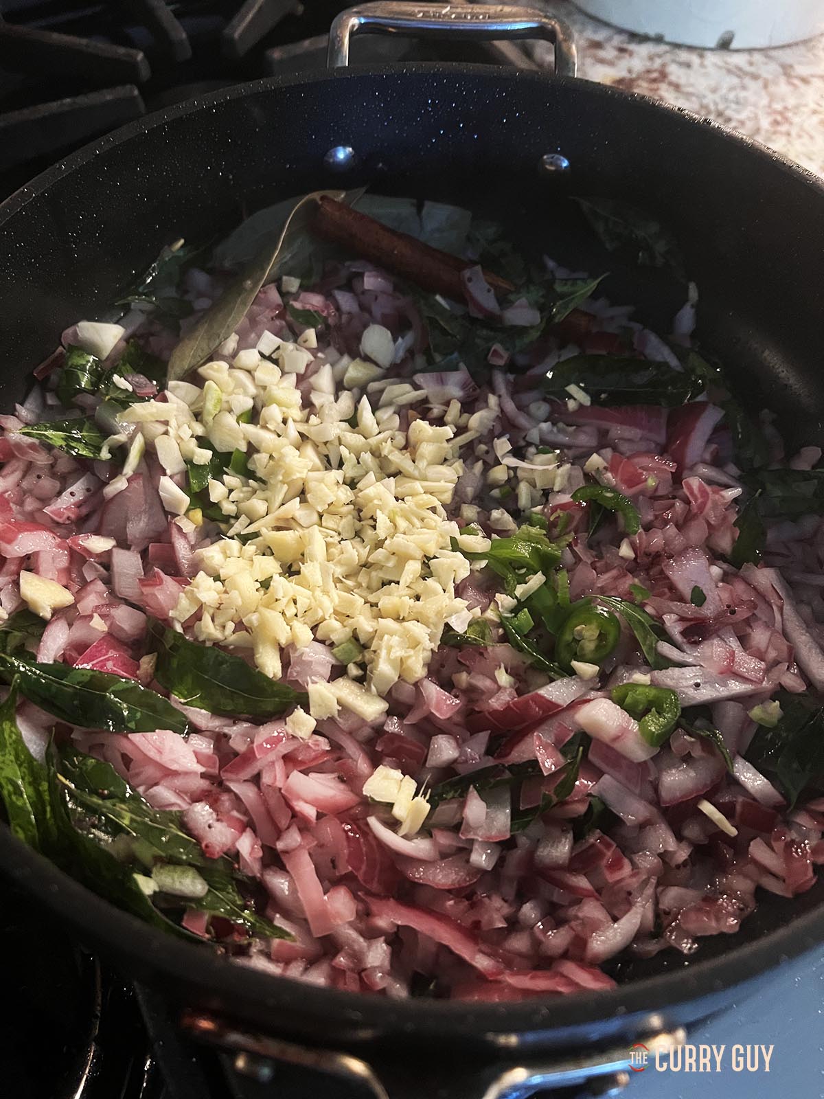 Adding the garlic, ginger and chillies.