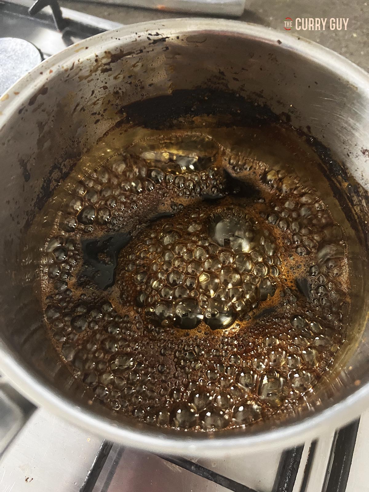 Simmering the kecap manis.