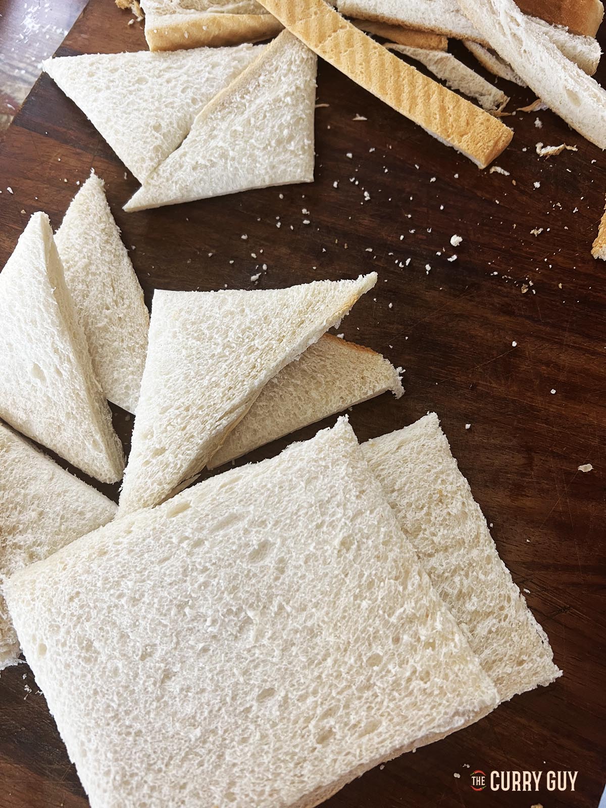 Slicing the bread into triangles
