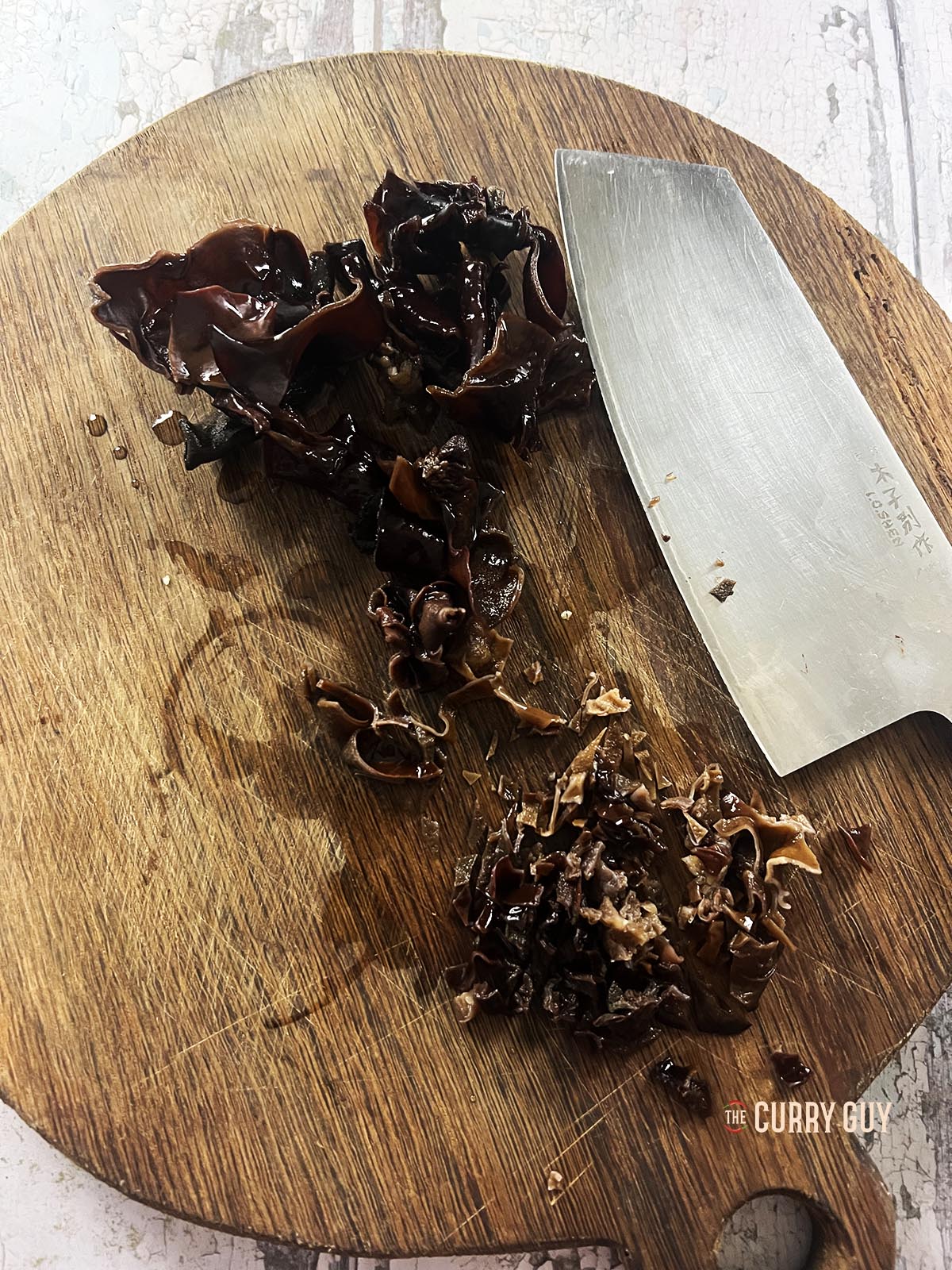 Chopping the wood ear mushrooms.