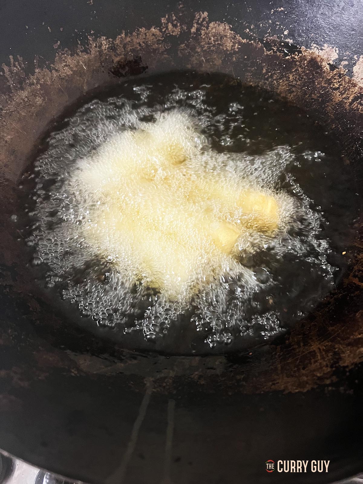 Frying vegetable spring rolls.