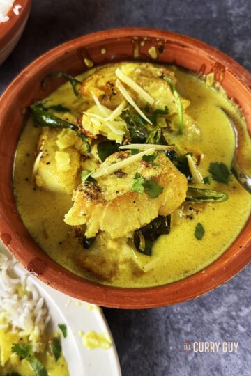 Coconut fish curry in a bowl.