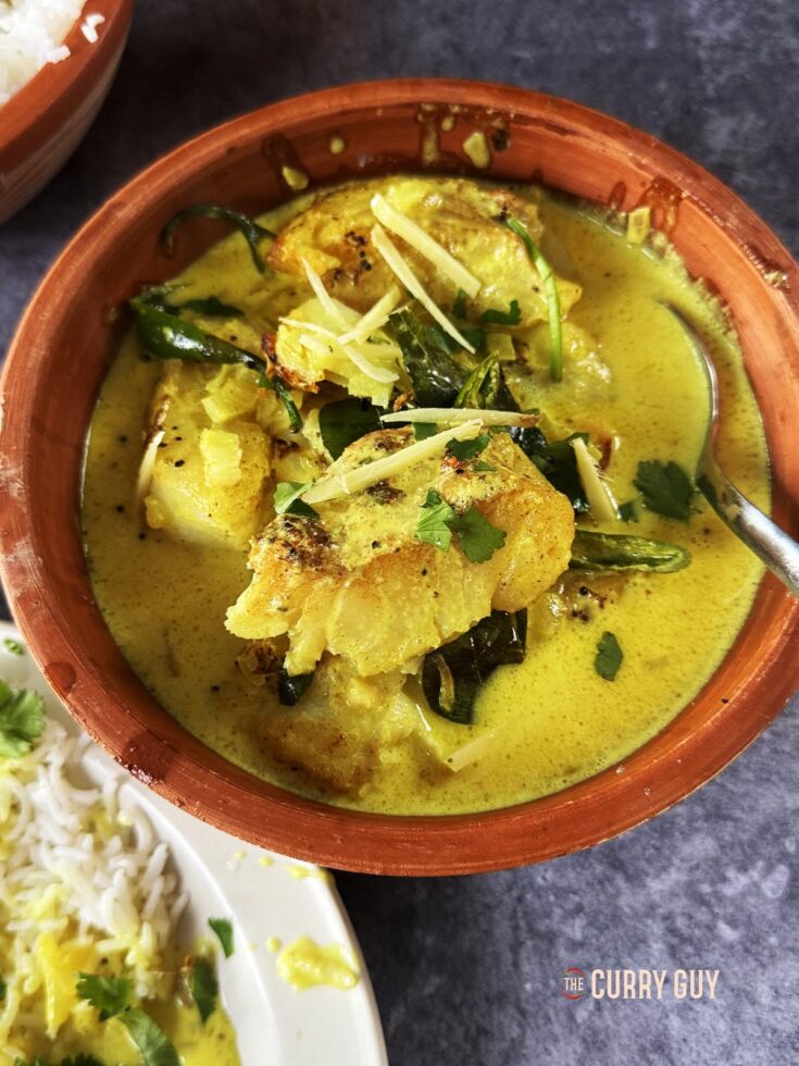 Coconut fish curry in a bowl.