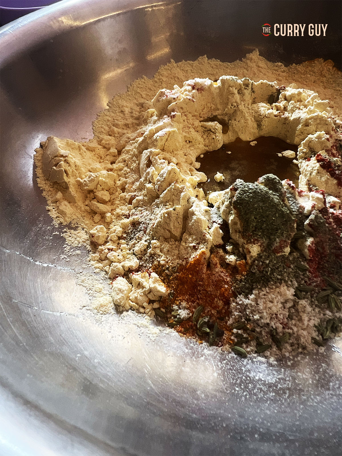 Mixing the ingredients for the dumplings in the pan.