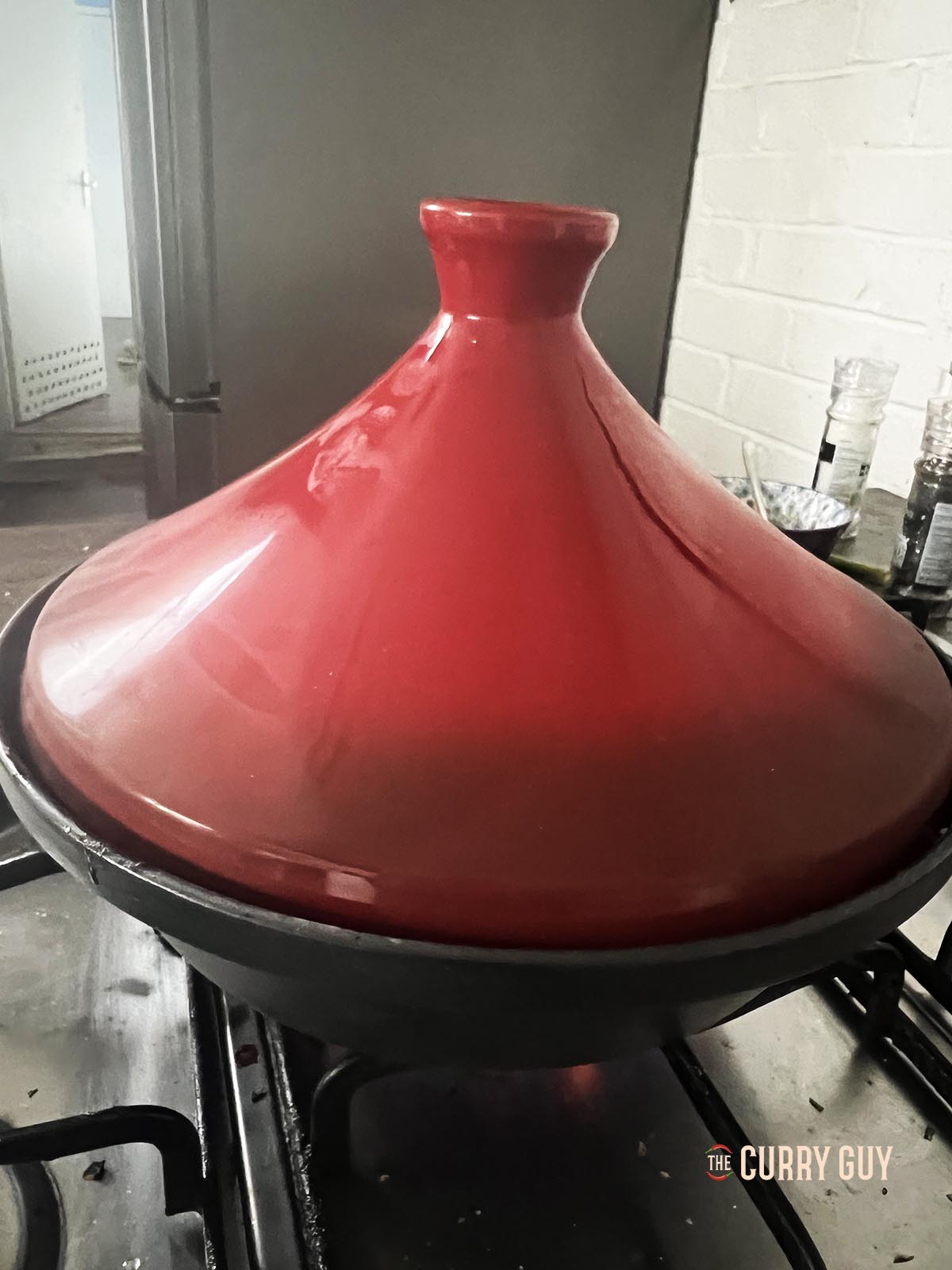 Placing the lid on the tagine.