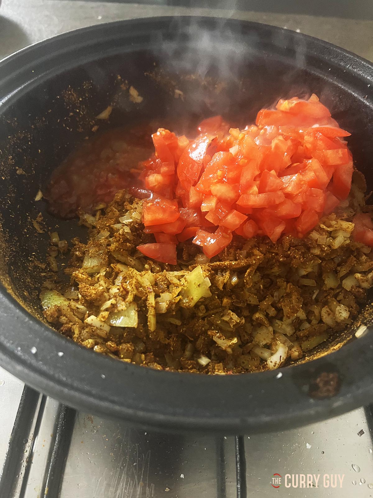 Adding the chopped tomatoes.