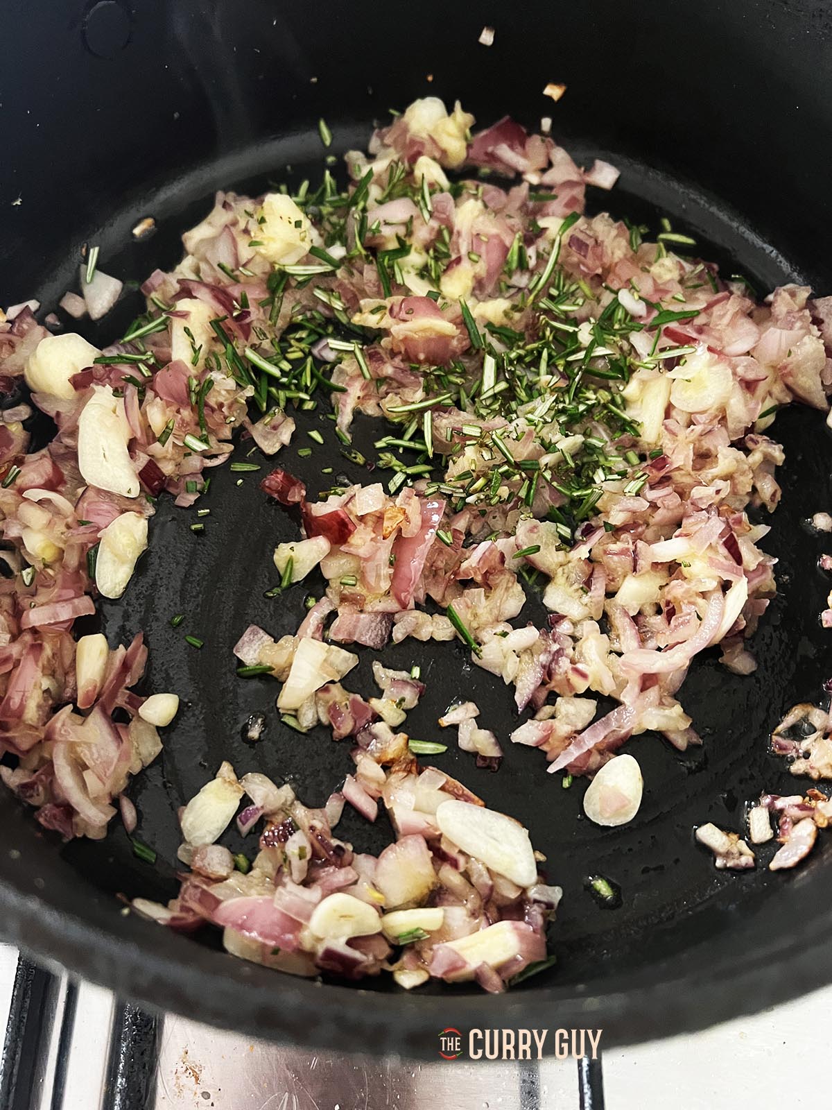 Stirring in the chopped rosemary.