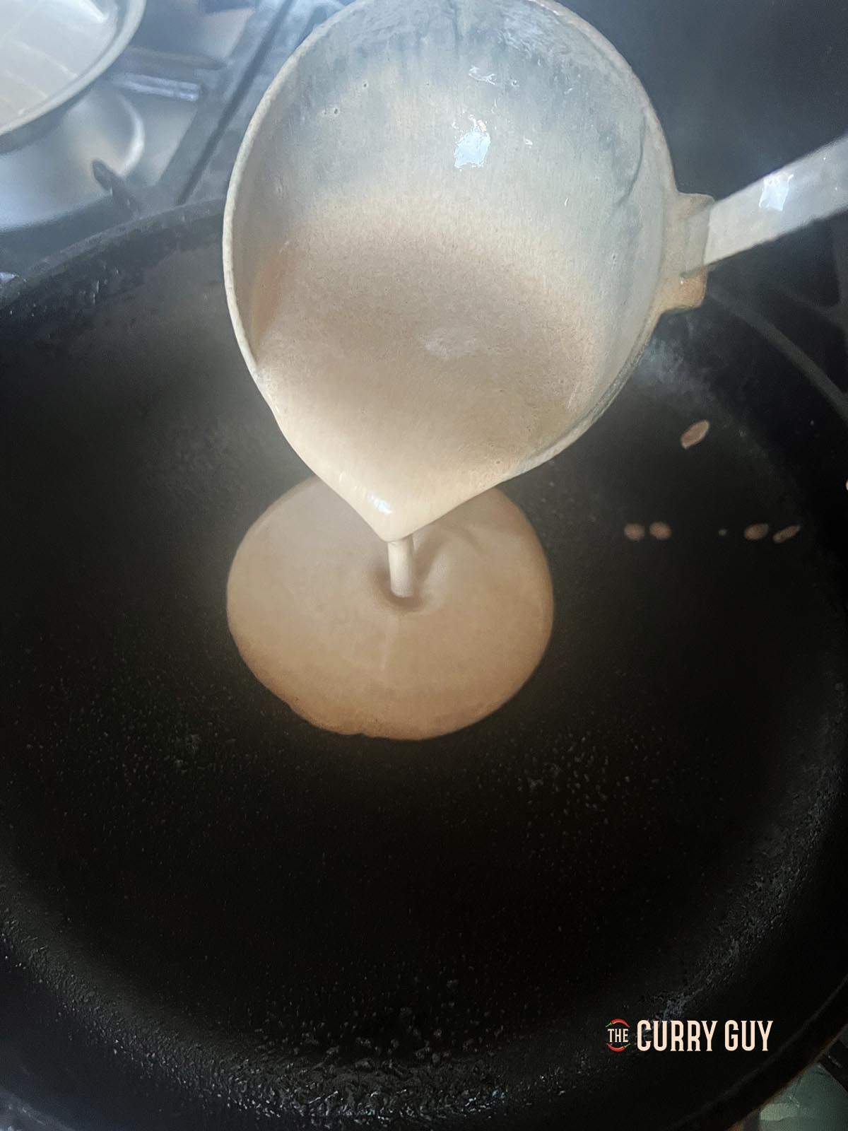 Pouring the batter into the pan.
