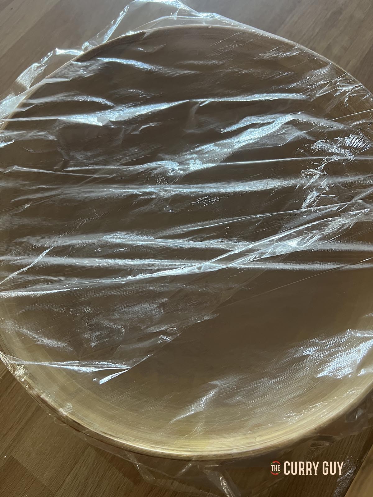 Covering the batter loosely with plastic wrap.