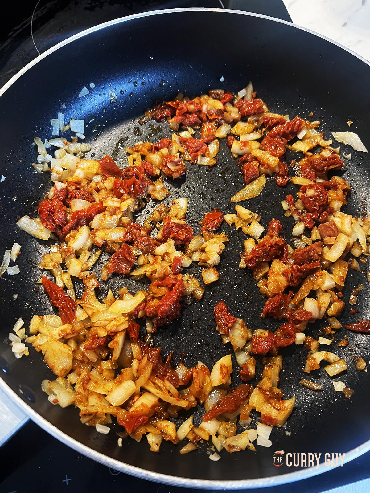 Frying onions and tomatoes